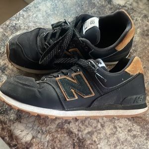 Black and tan New Balance 574